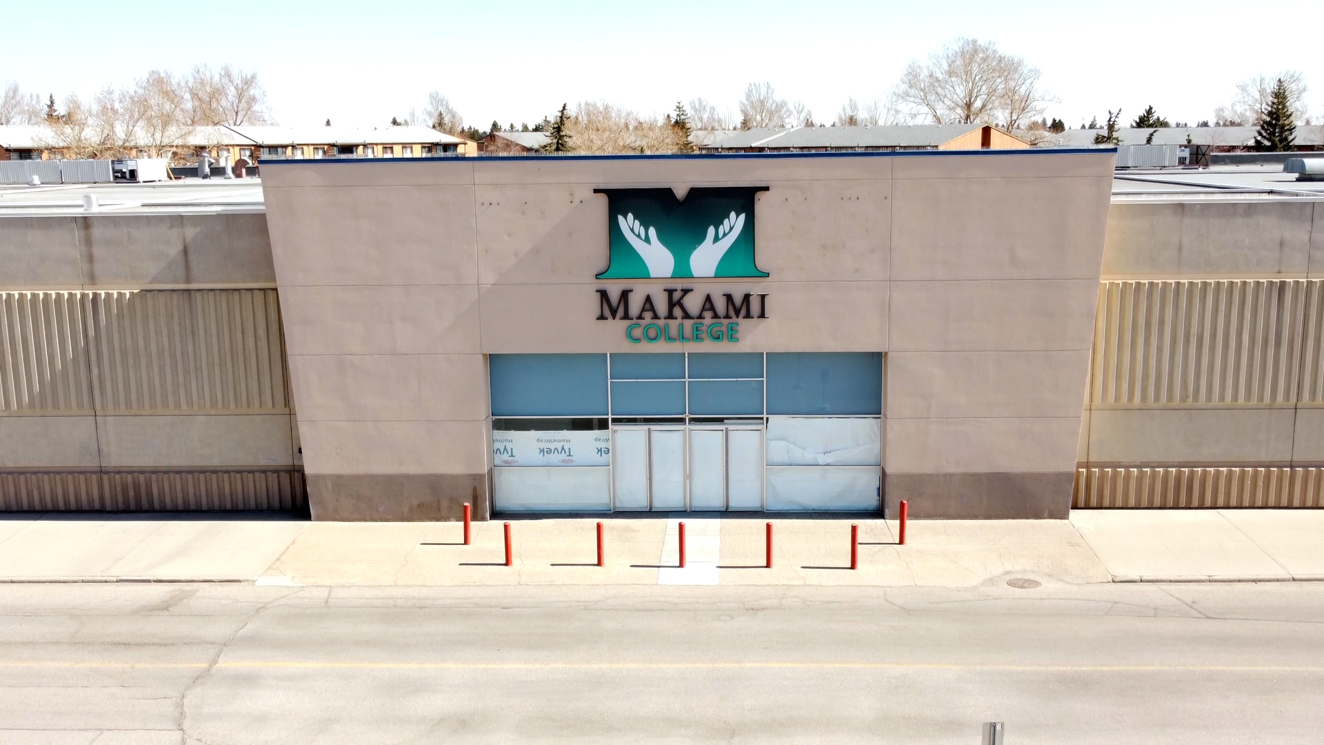 MaKami College logo sign on the exterior of a cement wall of Marlborough Mall in Calgary, Alberta, Canada