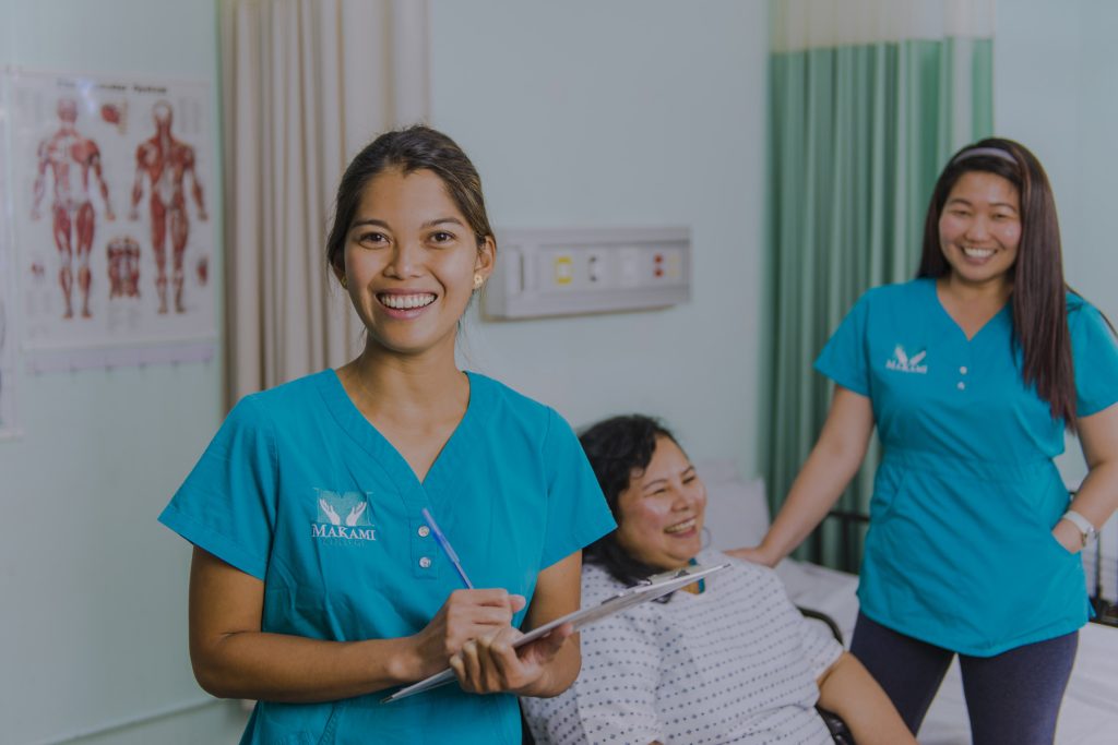 Health care aide students gaining hands-on training with patients in clinicals at MaKami College