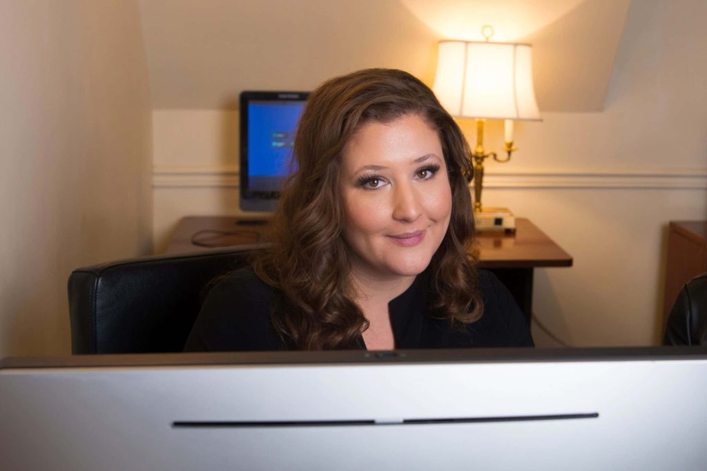 A close up image of Marija Pavkovic-Tovissi from over a computer in Edmonton, Alberta, Canada.