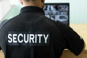 security guard in front of a security monitor