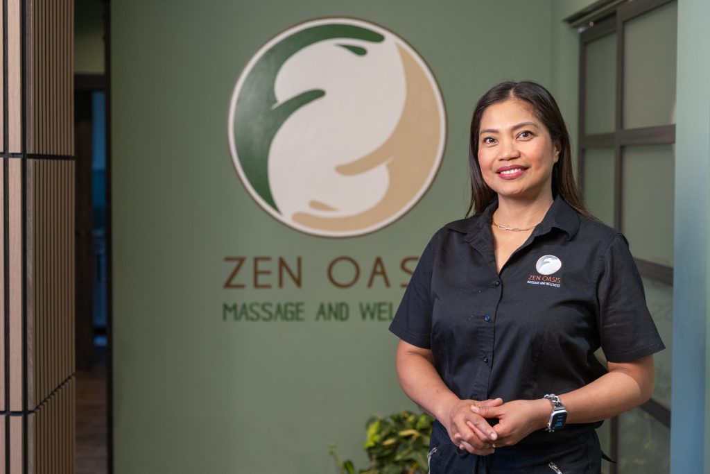 MaKami College massage therapy graduate Michelle Ujano at Zen Oasis Massage and Wellness Centre in Calgary.
