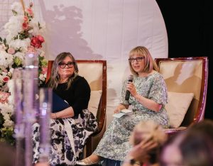 Robin Landalls-Hill speaks onstage beside a fellow panelist during the 2026 BOLD Woman Gala in Edmonton.